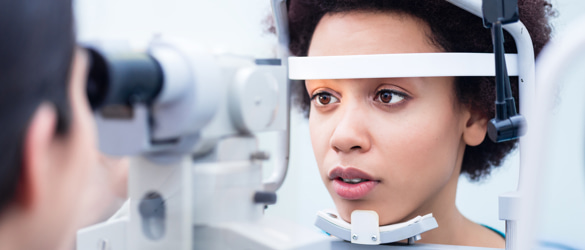 Woman having eye test
