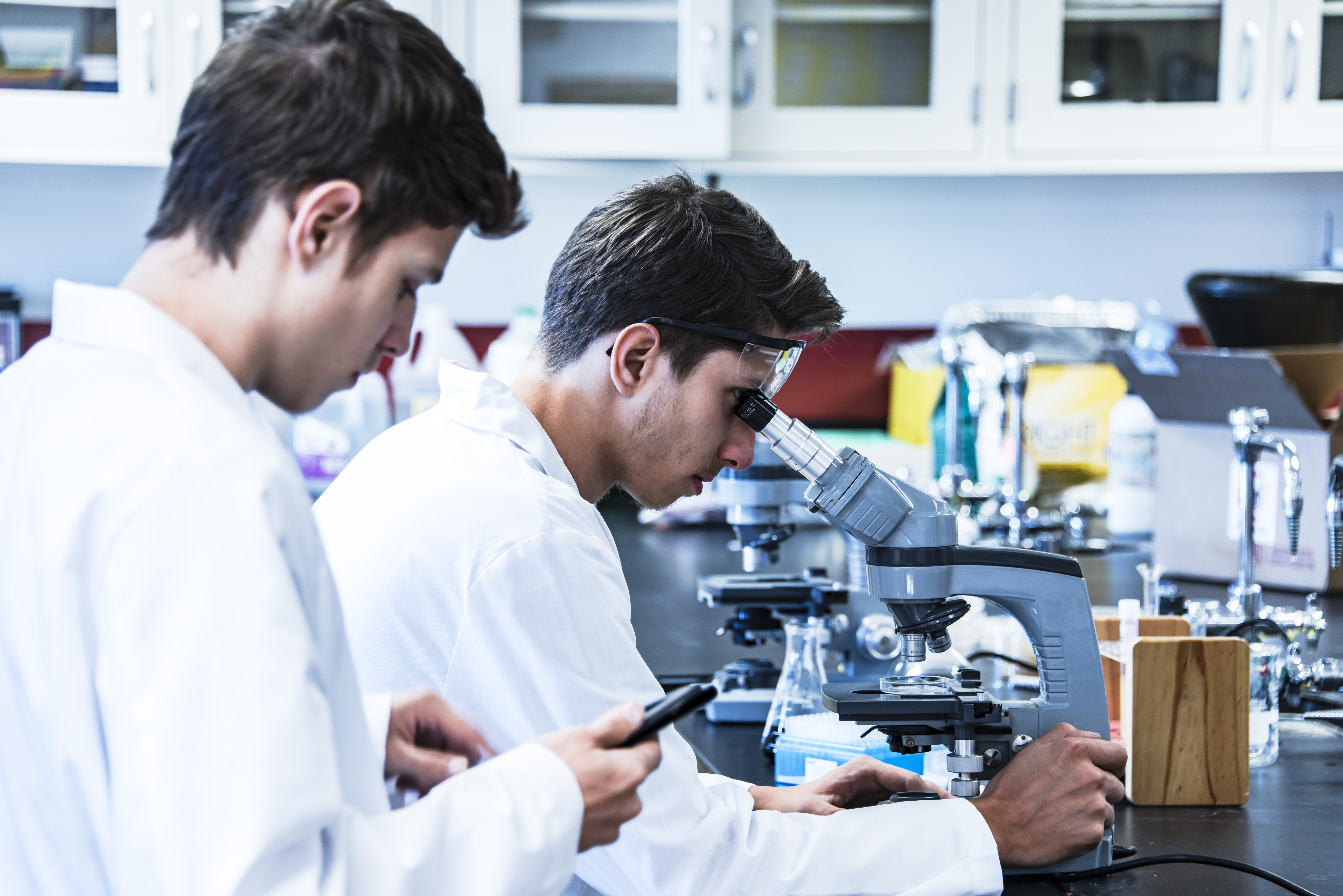 scientific research laboratory with two male researchers 