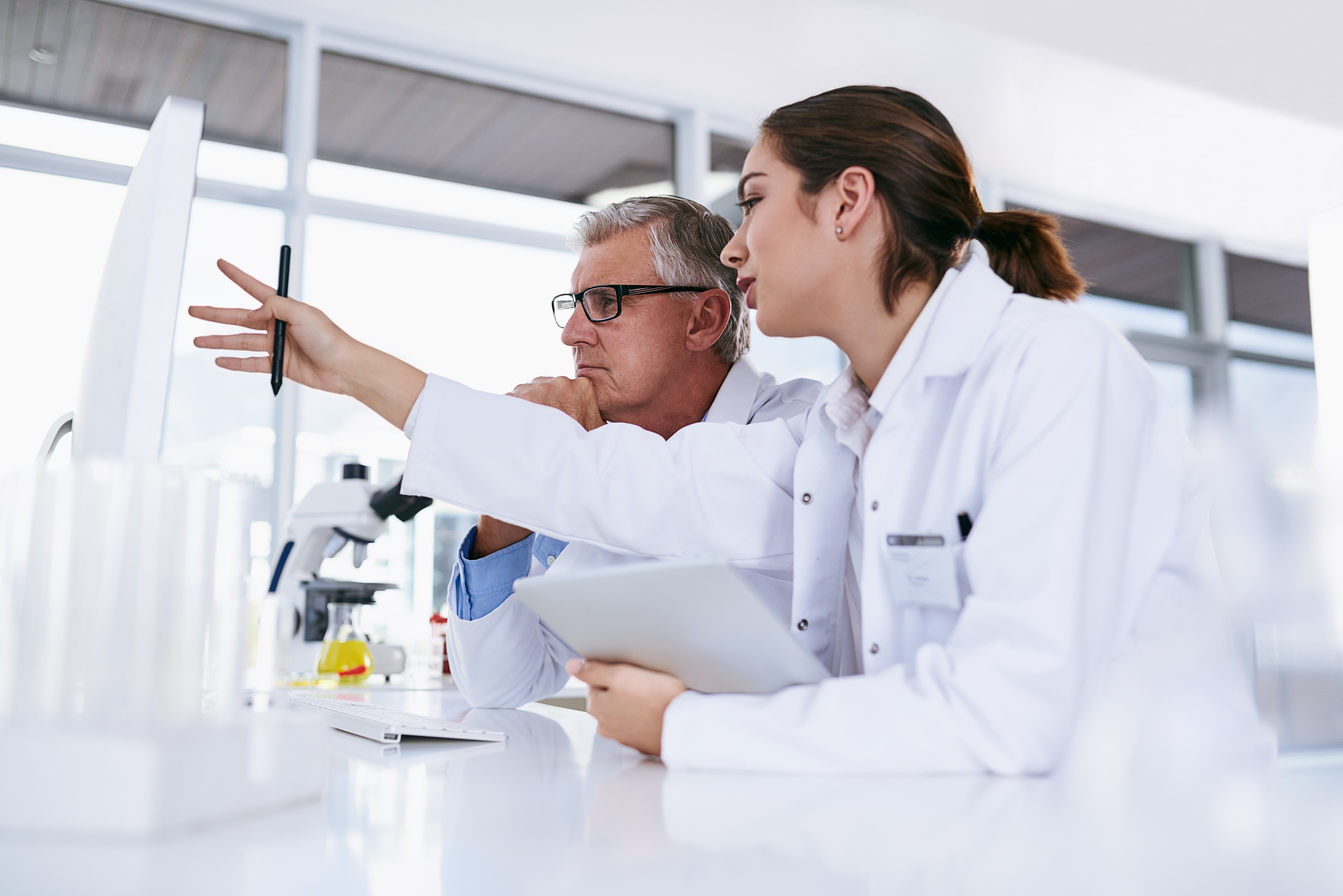 Medical research working together on a computer