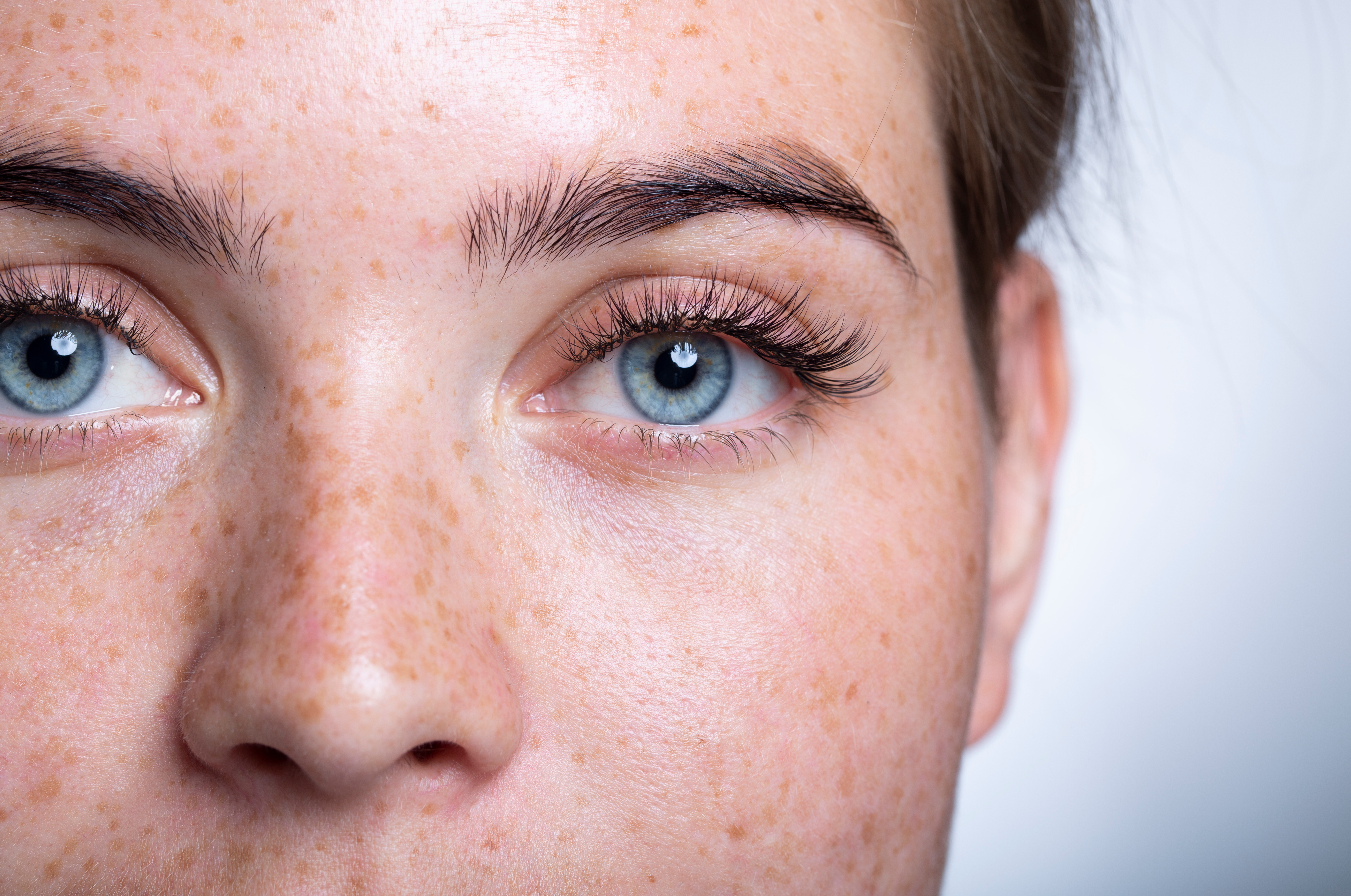 Close up on a woman's bright, young face