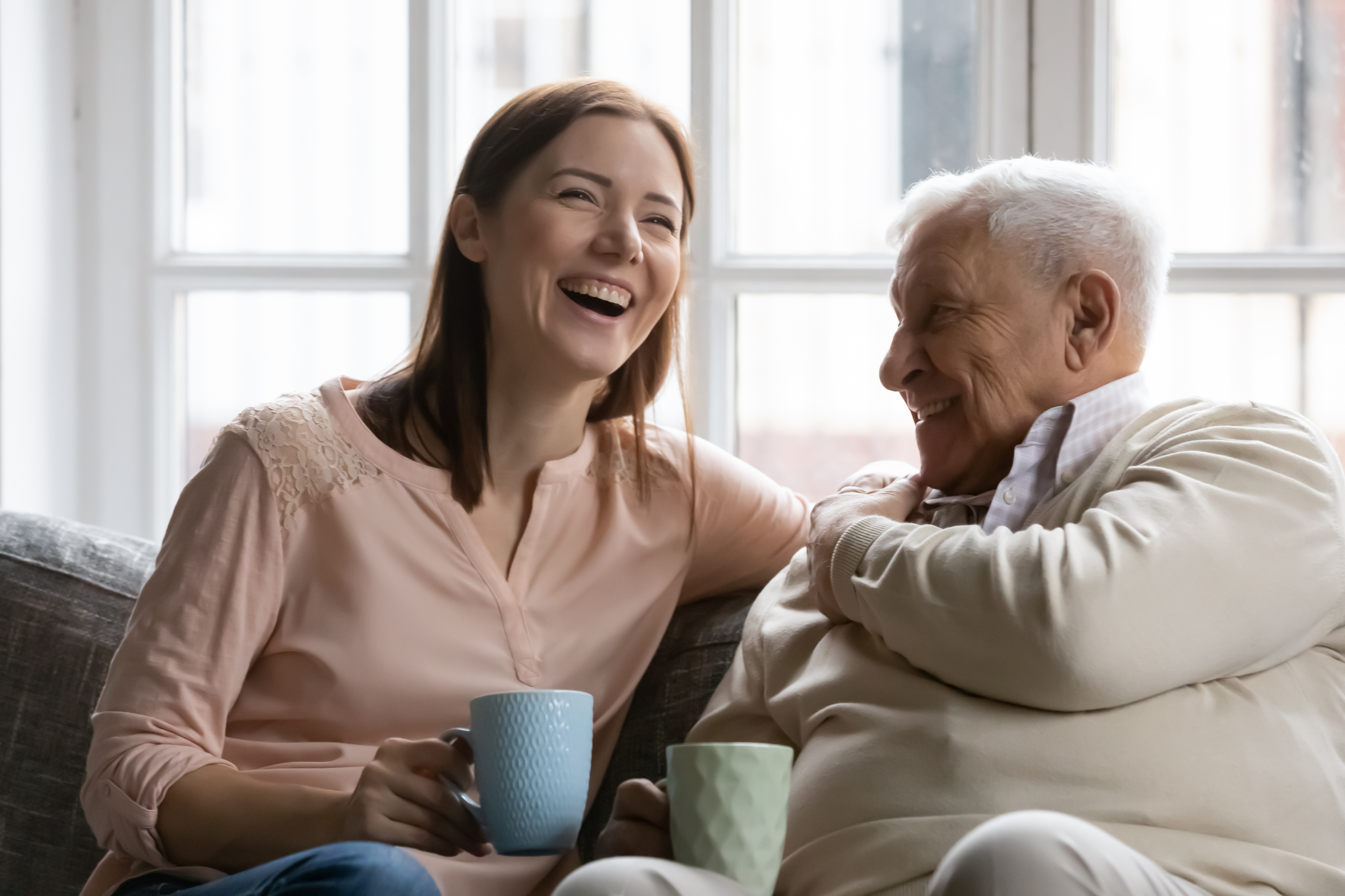 Grandaughter Grandfather Laughing Together